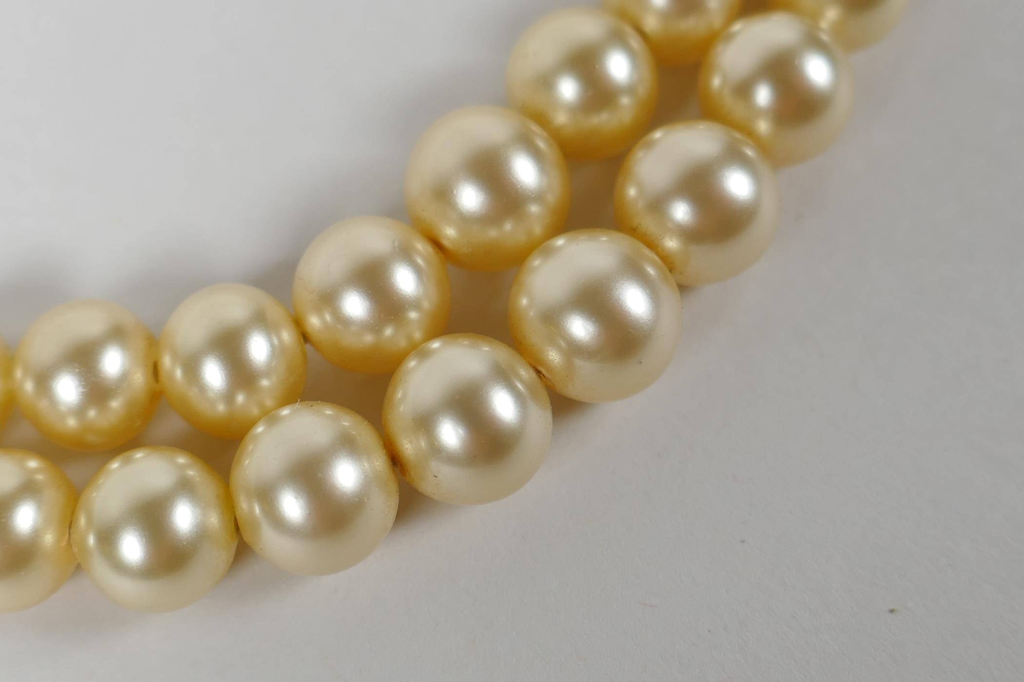 A vintage graduated pearl twin strand necklace, 38cm long - Image 2 of 4