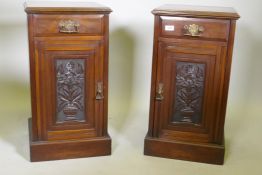 A pair of Victorian walnut bedside cabinets with single drawer over carved cupboard door, raised