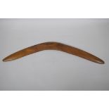 An Australian carved wood boomerang, 66cm