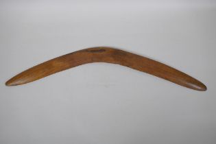 An Australian carved wood boomerang, 66cm