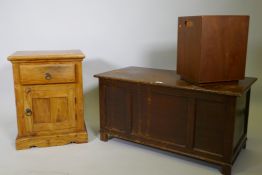 An oak veneered triple panel coffer raised on stile supports, 88 x 44 x 46cm