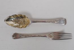 A Georgian silver berry spoon and fork, London 1812 and 1827, 78g