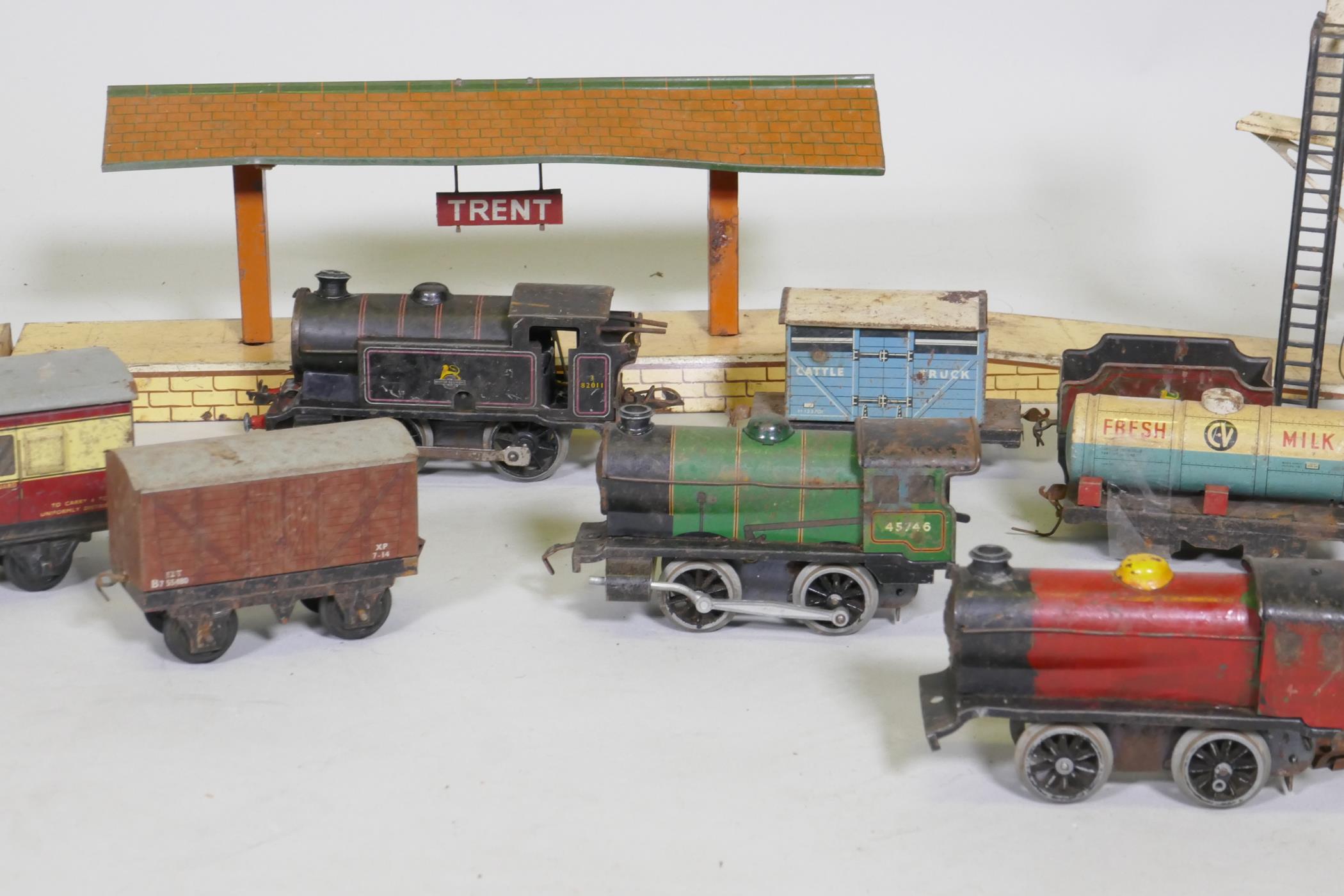 A vintage Hornby, Meccano Ltd O Gauge clockwork railway set, with two type 30 and one type 40