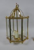 A brass ceiling lantern with concave glass panels, lantern 42cm high