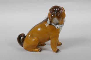 An antique continental porcelain pug dog, AF, marks to base, 13cm high