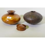 Treen, a New Zealand Rimu and Totana burr wood turned pot, signed to base Jim Ross, 19cm diameter,