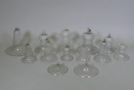 A collection of antique glass bell jars, largest 30cm high