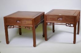 A pair of Chinese red wood side tables with a single drawer, 61 x 61cm, 55cm high
