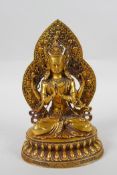 A Sino Tibetan gilt bronze figure of Buddha, double vajra mark to base, 17cm high