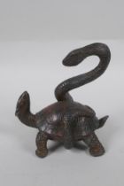 A Chinese bronze figure of a tortoise and snake entwined with each other, with the remnants of