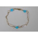 A 9ct gold and turquoise beaded bracelet, 19cm long