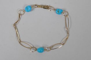 A 9ct gold and turquoise beaded bracelet, 19cm long