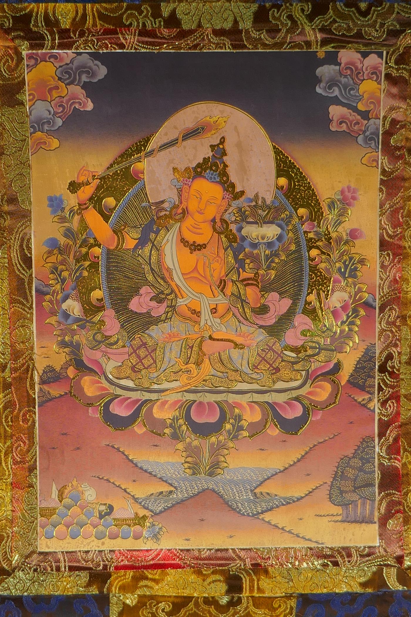 A Tibetan printed thangka in a silk scroll mount with gilt illuminated details, 48 x 62cm - Image 2 of 2