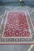 A good quality deep pile silk and wool carpet with Persian inspired design