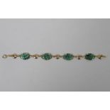 A 14ct gold and mottled jade bracelet, 18cm long