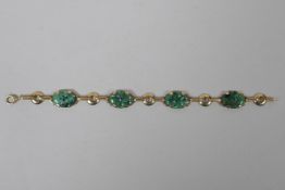 A 14ct gold and mottled jade bracelet, 18cm long