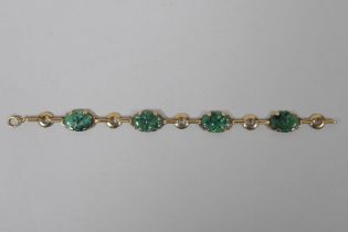 A 14ct gold and mottled jade bracelet, 18cm long
