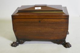 A good Regency mahogany two division tea caddy of sarcophagus shape, the interior with two lidded