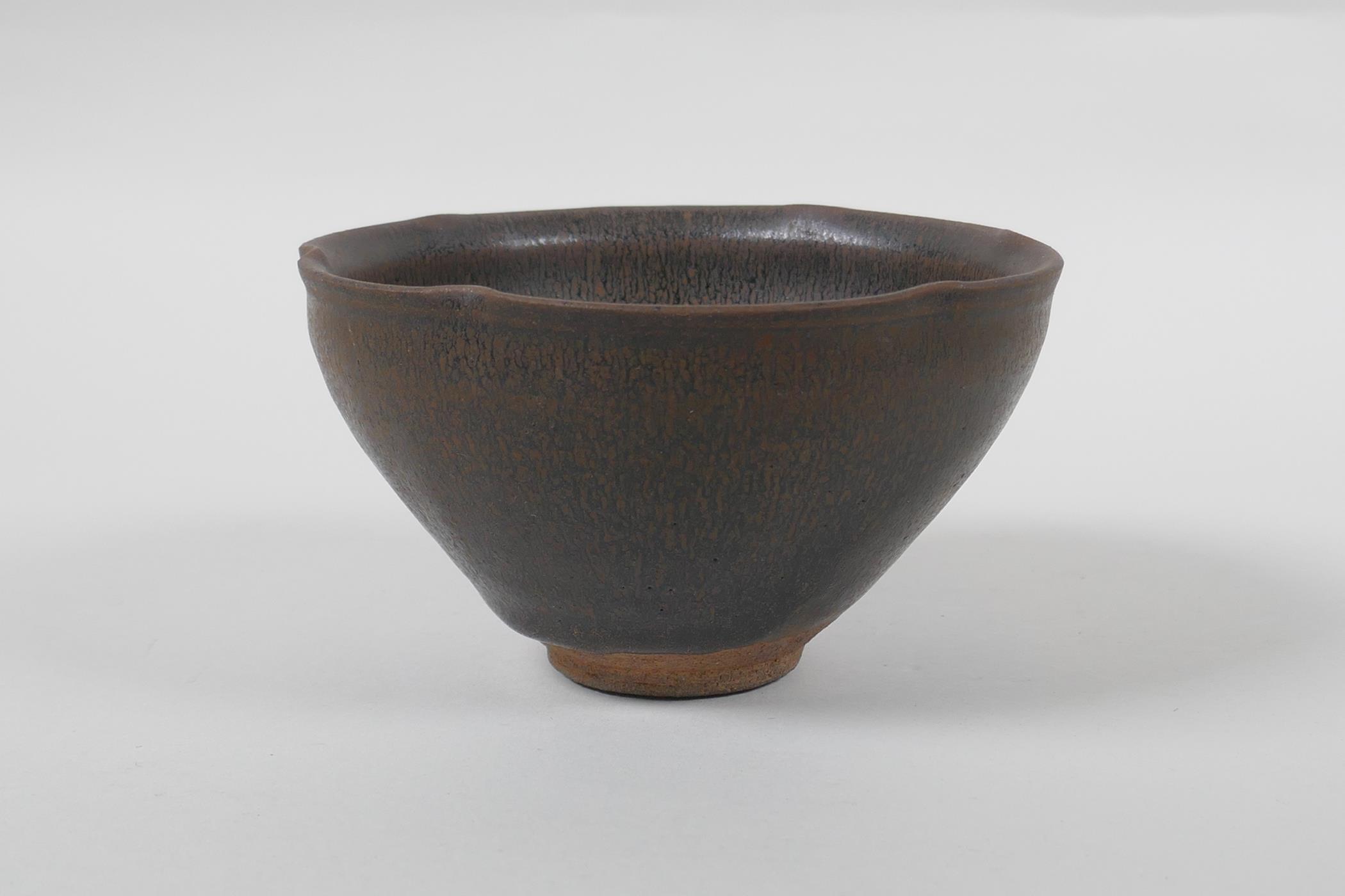 A Chinese Jian ware rice bowl/tea bowl, with lobed rim and hares fur glaze, indistinct mark to base,