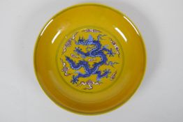 A yellow ground porcelain dish with blue and red dragon decoration, Chinese Chenghua 6 character