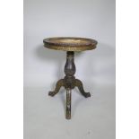 Am C18th/19th Chinese export lacquer table on a turned column and tripod supports, the top with