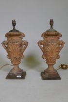 A pair of vintage terracotta urn table lamps, with brass mounts, 51cm high