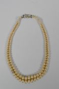 A vintage graduated pearl twin strand necklace, 38cm long