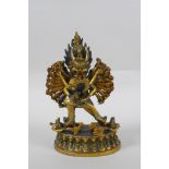 A Tibetan gilt bronze figure of Yamantaka, with cold painted details, 18cm high