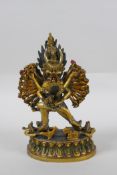 A Tibetan gilt bronze figure of Yamantaka, with cold painted details, 18cm high