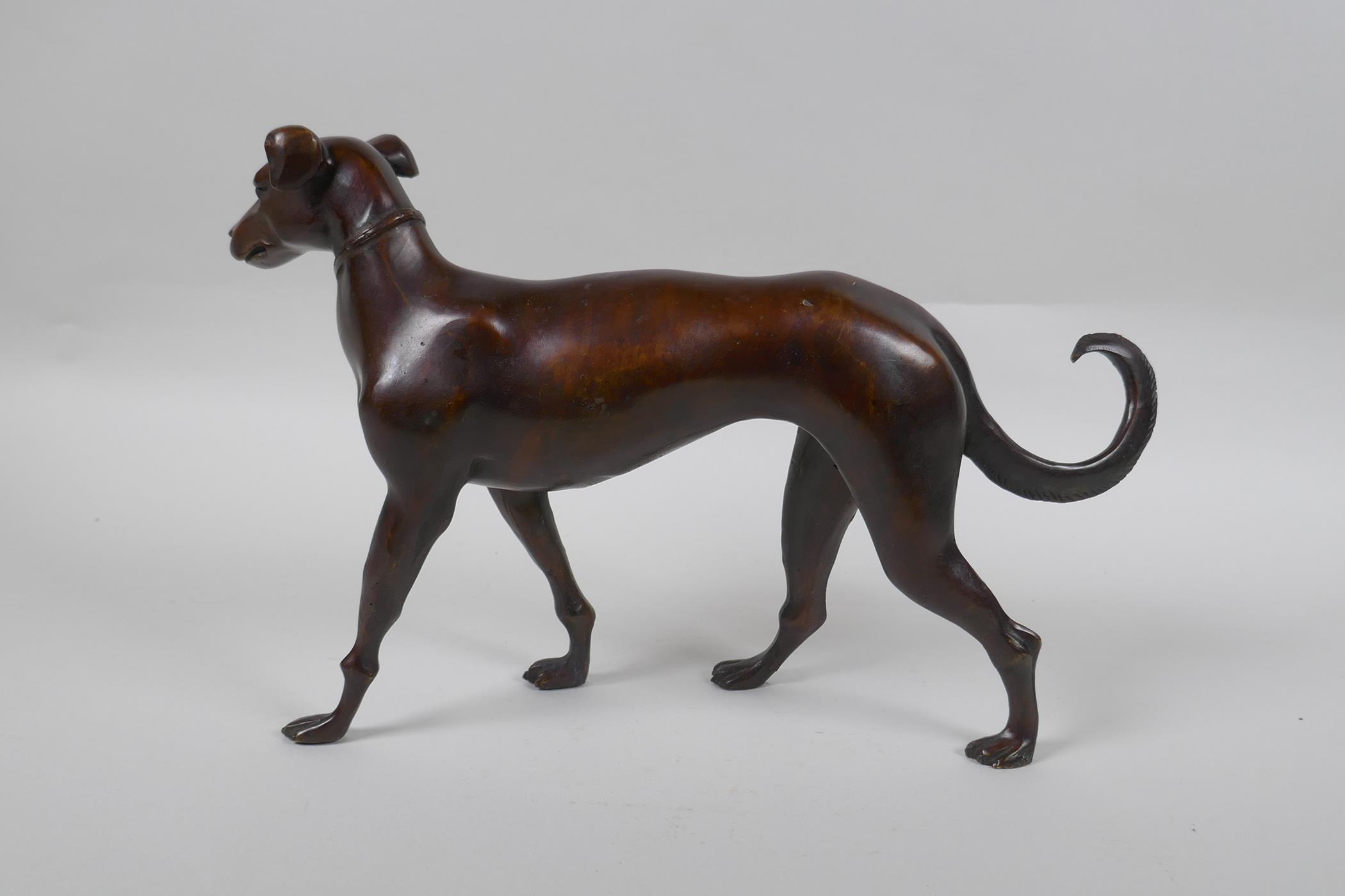 A filled bronze figure of a dog, 32cm long - Image 2 of 2