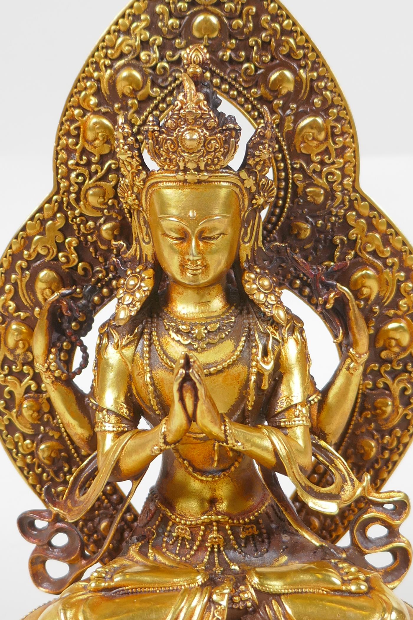 A Sino Tibetan gilt bronze figure of Buddha, double vajra mark to base, 17cm high - Image 2 of 5