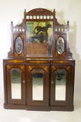 A Victorian walnut mirror backed chiffonier with breakfront base and three glazed doors, 115 x 30