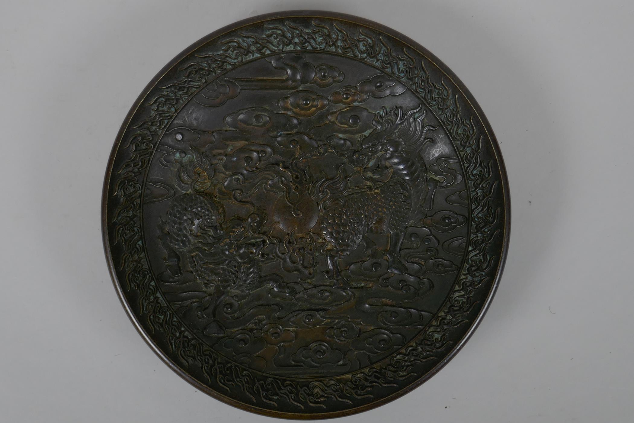A Chinese bronze dish with raised kylin decoration, Xuande 4 character mark to base, 18cm diameter - Image 2 of 5