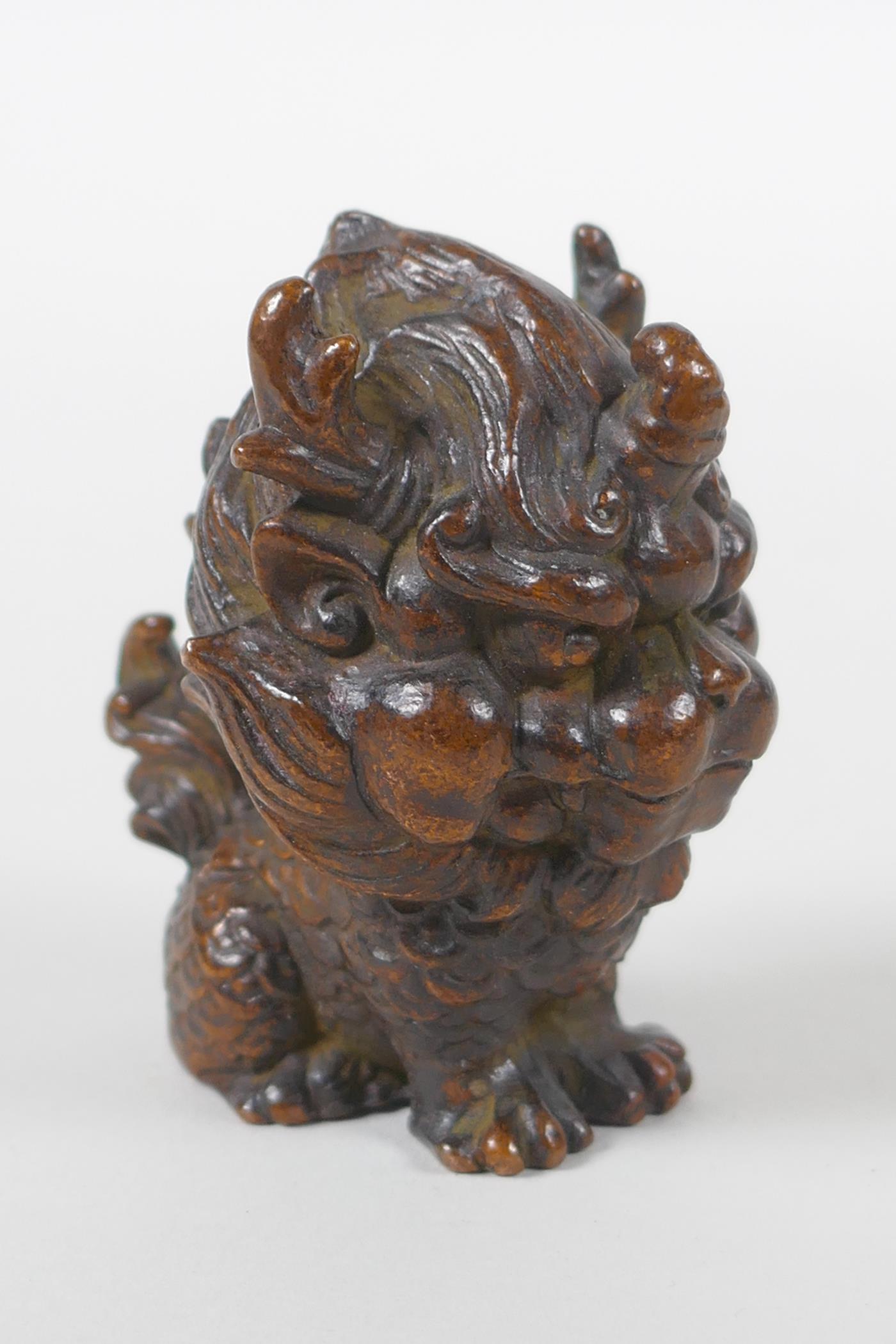 An oriental cast bronze figure of a stylised kylin, 6cm high - Image 2 of 3