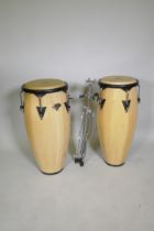 A pair of Latin percussion CP Congas and stand, 30cm diameter and 33cm diameter