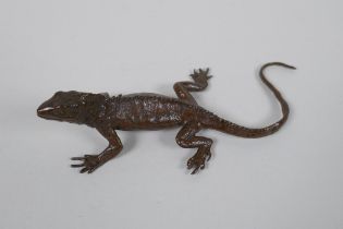 A Japanese style bronze okimono lizard, 15cm long, impress mark to belly