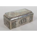 An antique continental silver box decorated with an inset painting on ivorine depicting archers,