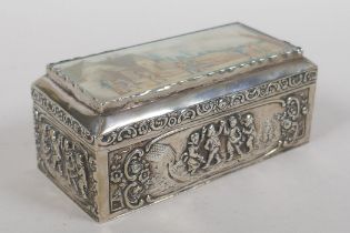 An antique continental silver box decorated with an inset painting on ivorine depicting archers,