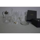 Two boxed pairs of Waterford crystal 'Lismore Essence' champagne flutes, a ship's decanter and