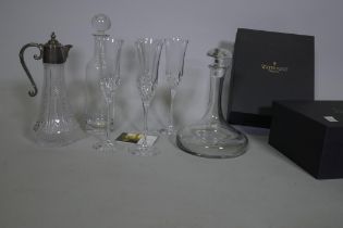 Two boxed pairs of Waterford crystal 'Lismore Essence' champagne flutes, a ship's decanter and
