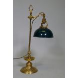 An ormolu table lamp with adjustable painted toleaware shade, the base with fine engraved and