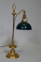 An ormolu table lamp with adjustable painted toleaware shade, the base with fine engraved and