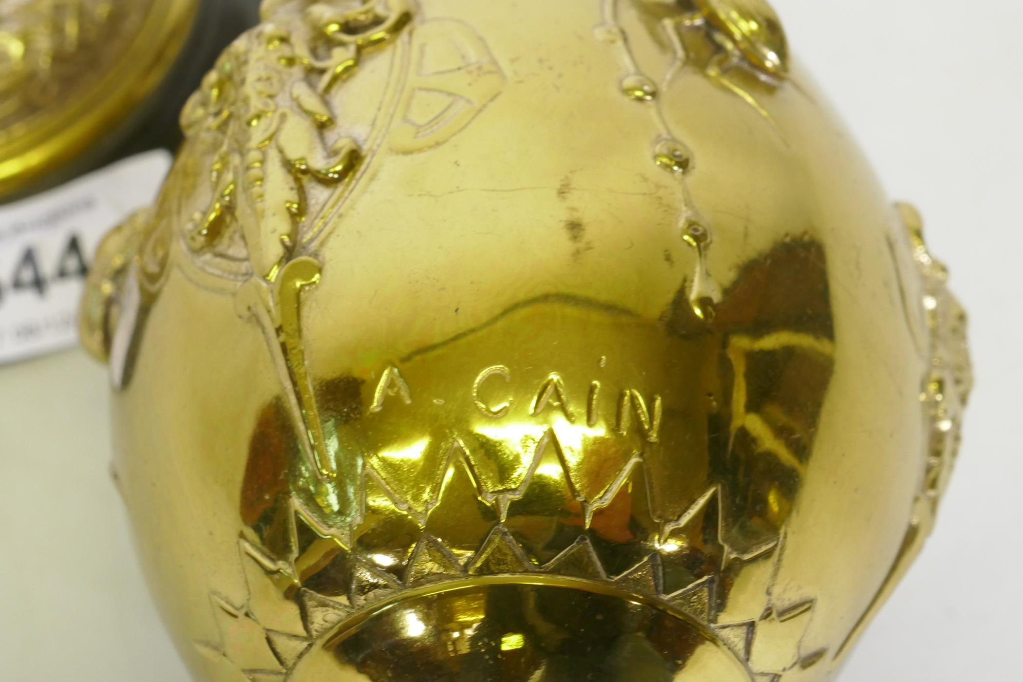 After August Cain, silver and gilt plated urn and cover, with stork finial, with raised decoration - Image 5 of 6