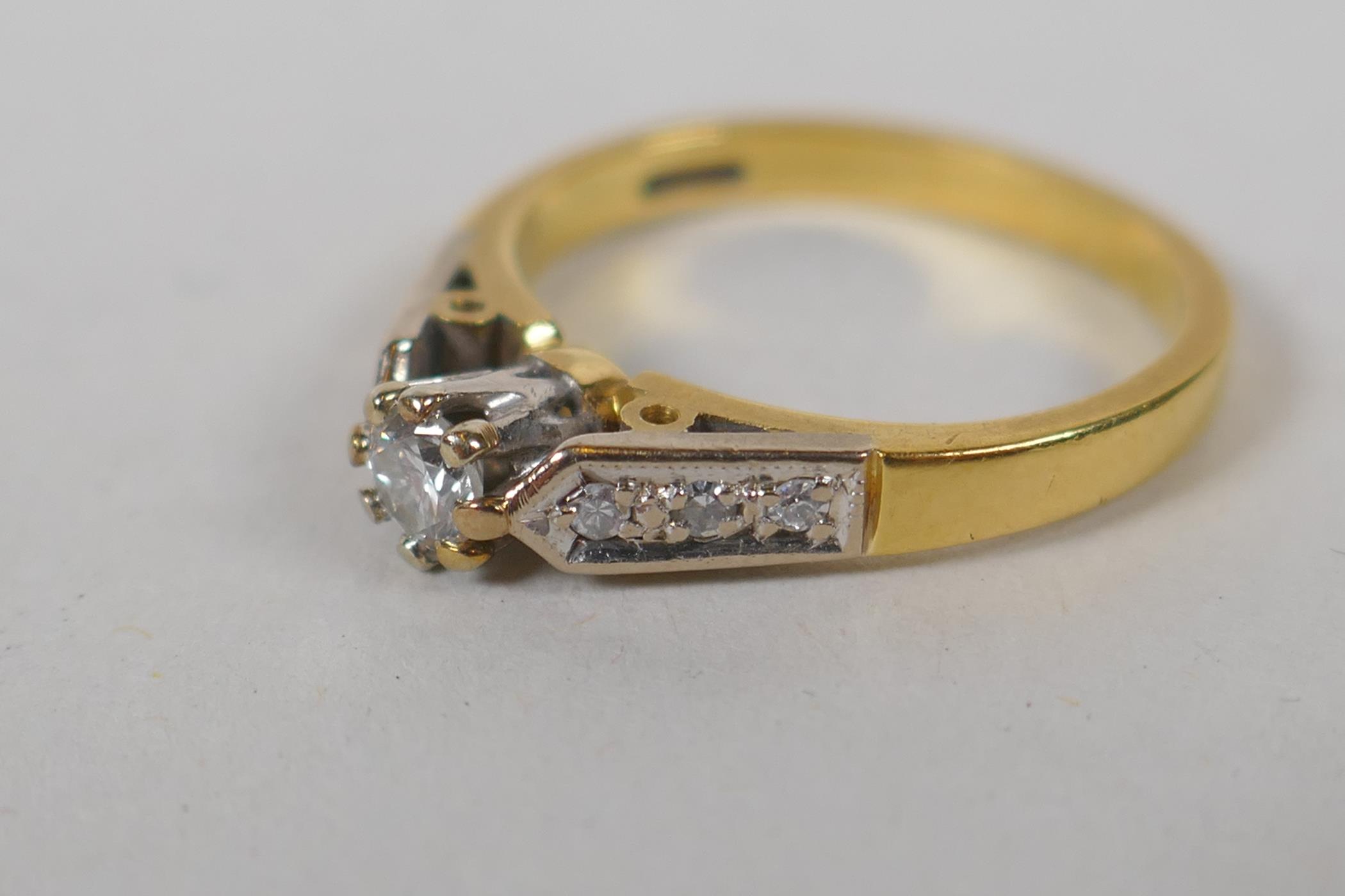 An 18ct yellow gold and diamond ring, with a central set diamond and three diamonds set to each - Image 3 of 5