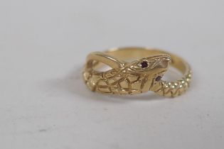 A 9ct gold snake ring set with ruby eyes, 3g