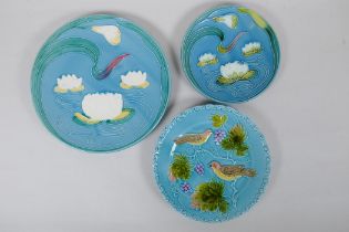 Two West German blue ground majolica dishes with Art Nouveau lotus flower design, and another