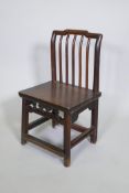 An antique Chinese elm spindle back low chair, 72cm high