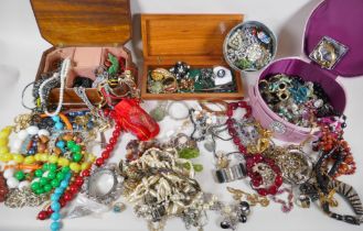 A large quantity of vintage costume jewellery and jewellery boxes, including necklaces, pendants,