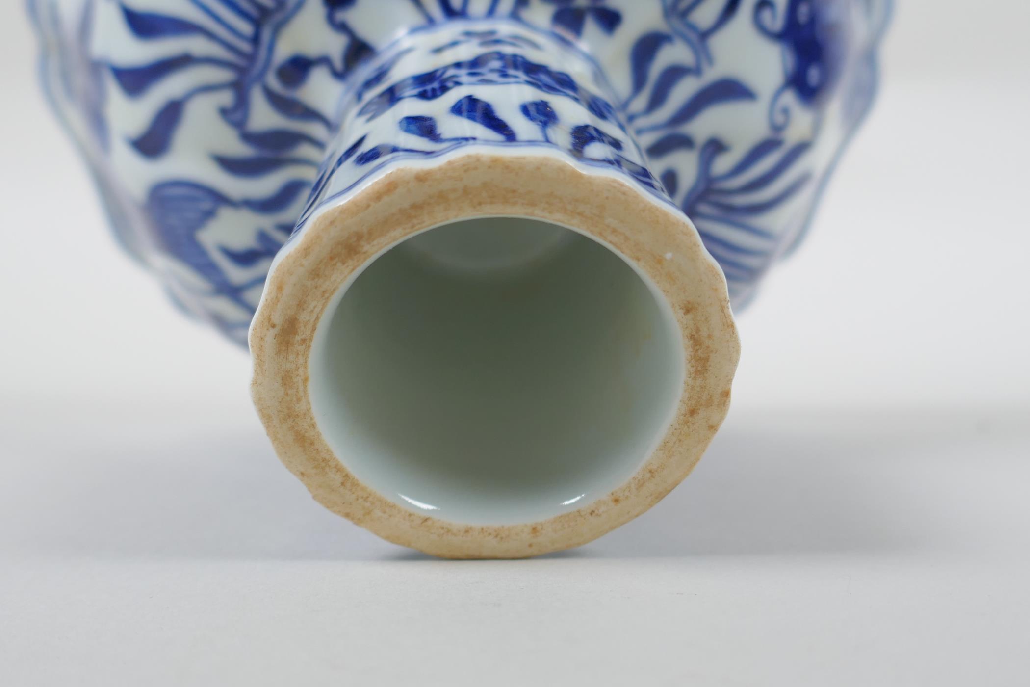 A Chinese blue and white porcelain stem bowl of lobed form decorated with carp in a lotus pond, - Image 5 of 7