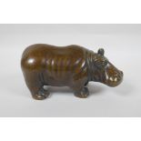 A filled bronze figure of a hippopotamus, 21cm long